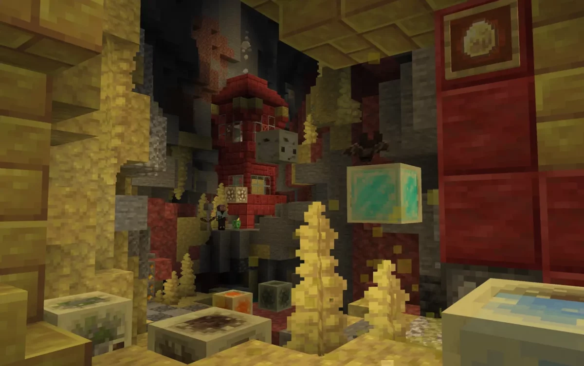 Joueur près d'une maison en cinabre dans Minecraft, face à un cube de soufre ayant absorbé de la pierre lumineuse