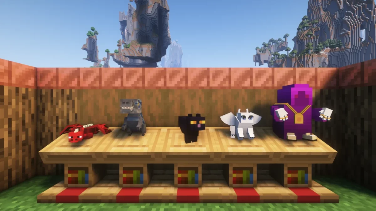 mod Minecraft Plushables montrant cinq peluches au style cubique fidèle à l'esthétique du jeu