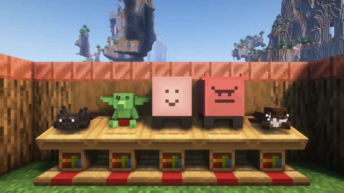 mod Minecraft Plushables avec cinq nouvelles peluches colorées posées côte à côte