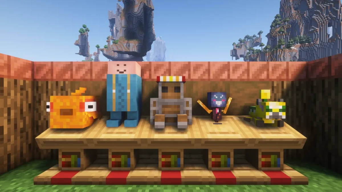 mod Minecraft Plushables montrant cinq peluches qui réagissent par des sons et des particules