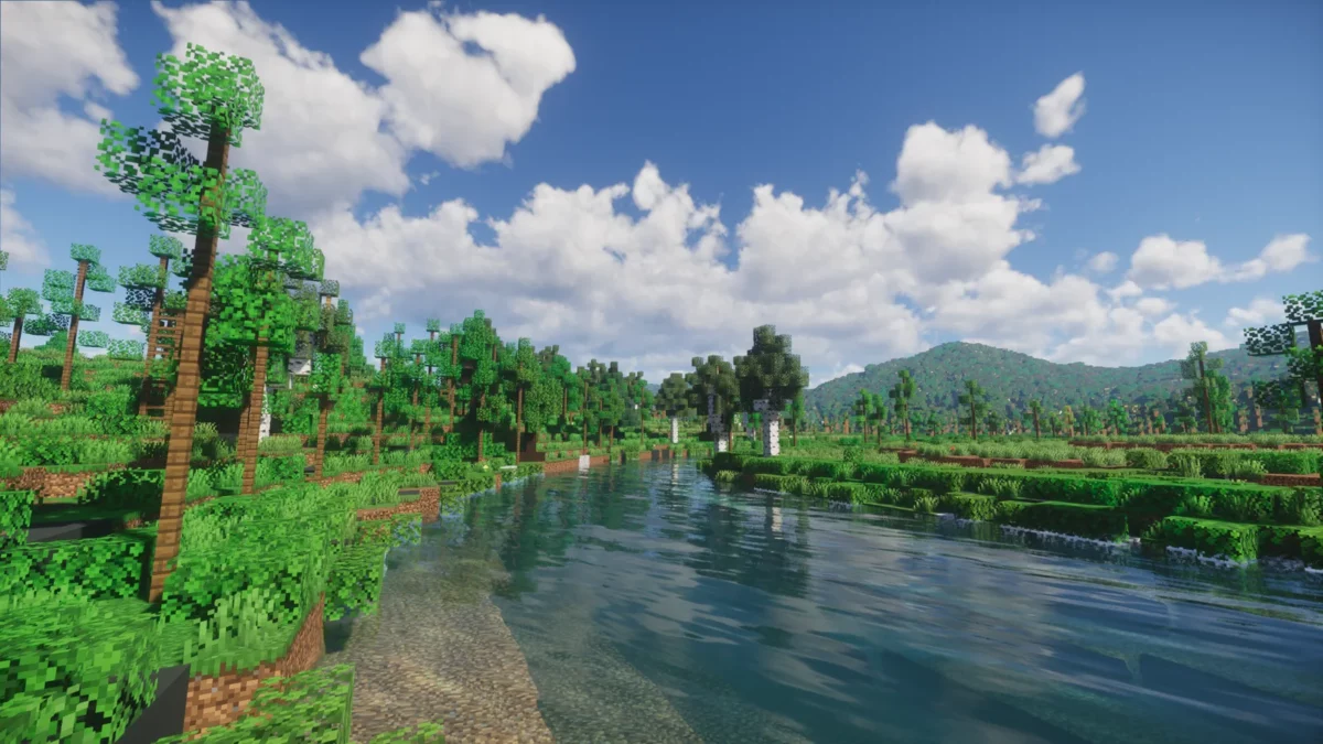 shader Minecraft Spring Shaders rivière limpide traversant une forêt printanière verdoyante sous un ciel bleu nuageux