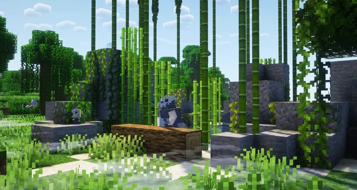 mod Minecraft Cobblemon 1.8 Pandespiègles installés dans un habitat de bambous entouré de ruines