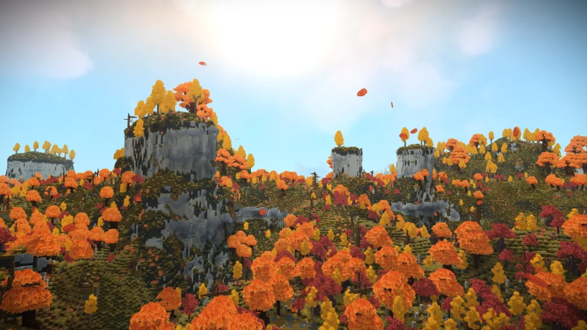 Citadelles de pierre dominant une forêt aux couleurs d'automne dans Hytale