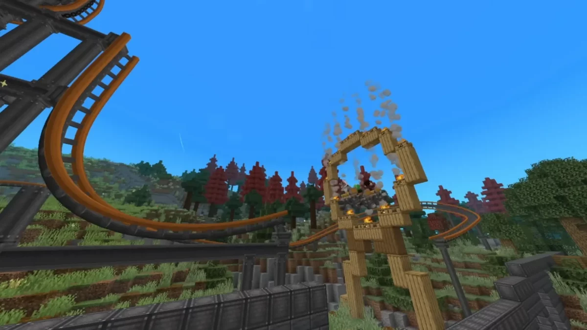 Rails orange de montagnes russes traversant un décor forestier construit avec le mod Create