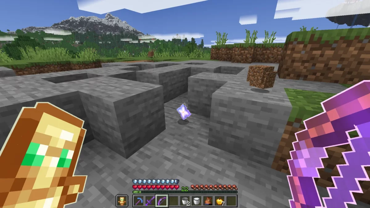 Pioche enchantée soulignée près d’une étoile du Nether après la défaite du Wither dans Minecraft