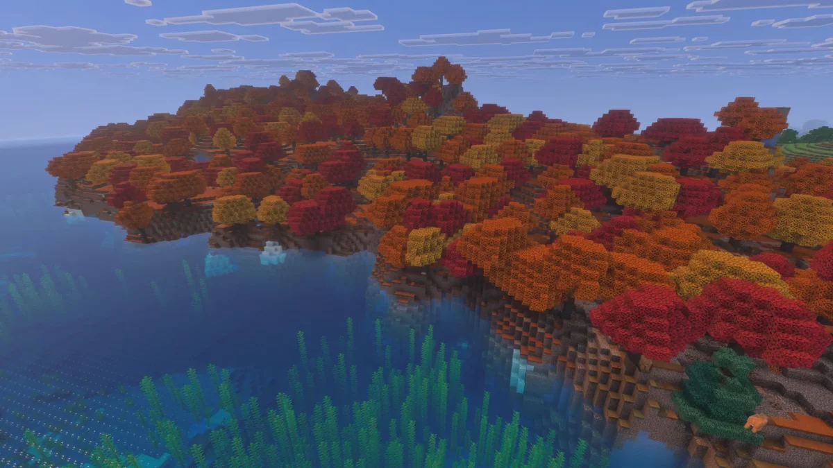 Forêt tachetée de Minecraft vue du ciel au bord d'un océan froid, avec de la glace flottante et des algues sous la surface