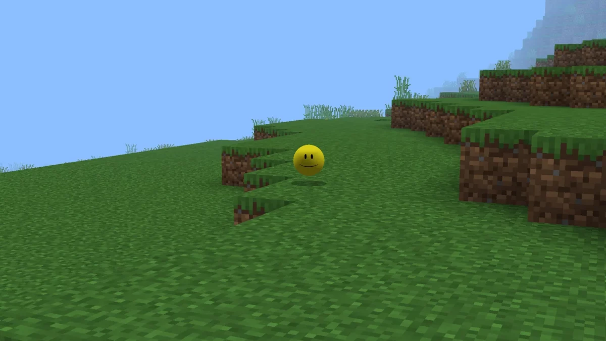 La sphère jaune Verity attend le joueur sur un bloc d'herbe dans Minecraft