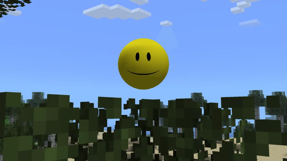 Gros plan sur le visage souriant de Verity flottant au-dessus des feuilles Minecraft