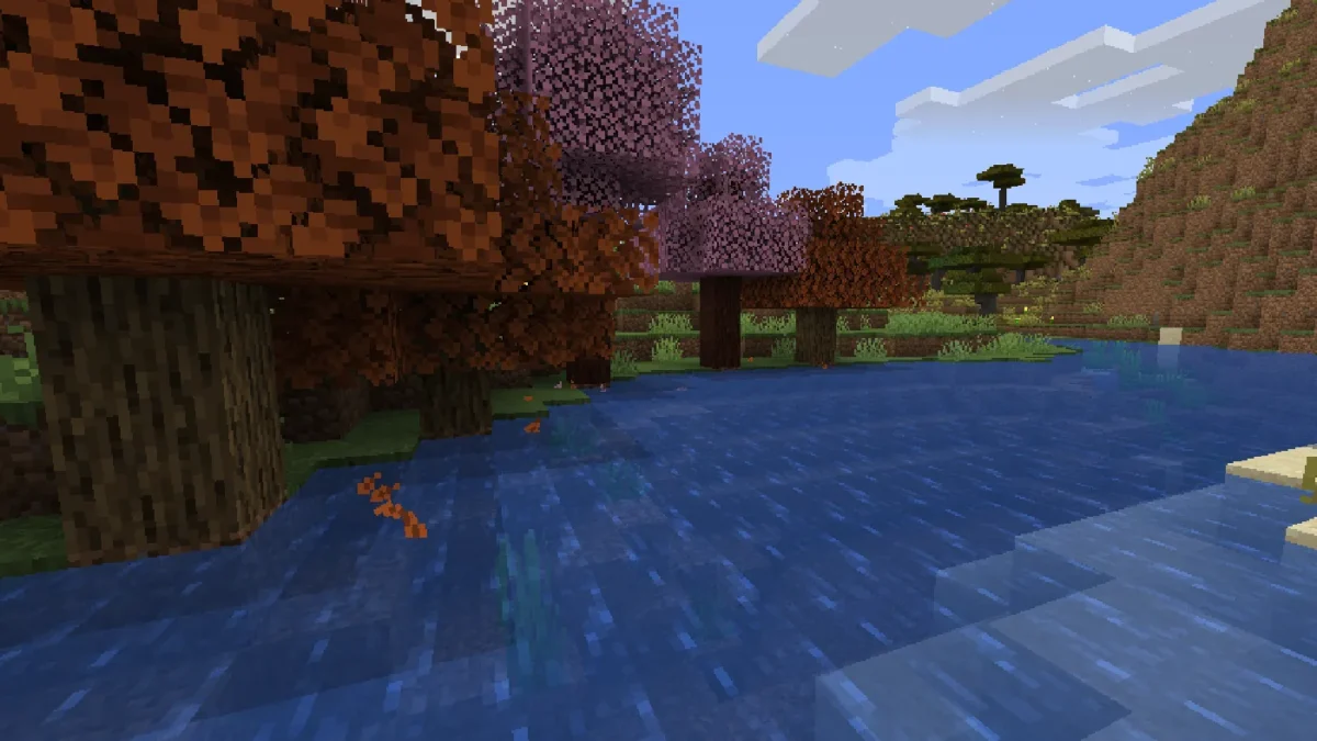 Feuilles orange tombant d’arbres automnaux ajoutés par un mod avec Falling Leaves dans Minecraft