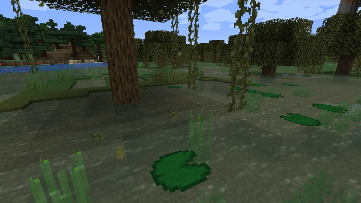 Feuilles détachées flottant au-dessus de l’eau dans un marais verdoyant de Minecraft