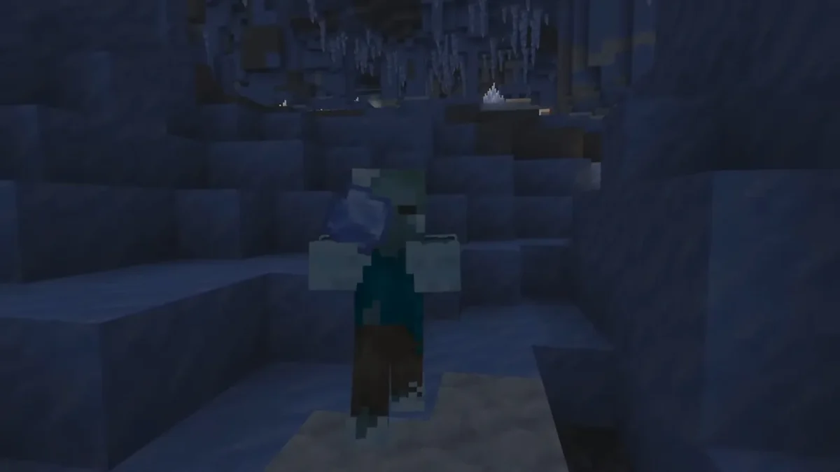 Un zombie gelé tient une boule de glace dans une grotte sombre pendant le Minecraft Live