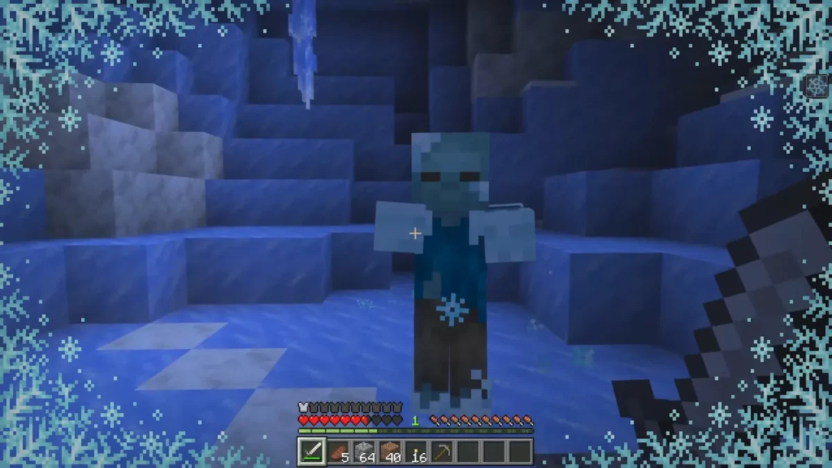 Un zombie gelé approche tandis qu’une bordure de givre apparaît sur l’écran de Minecraft