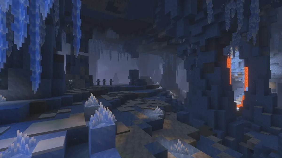 Une grotte glacée de Minecraft montre ses stalactites et son terrain gelé près de la lave