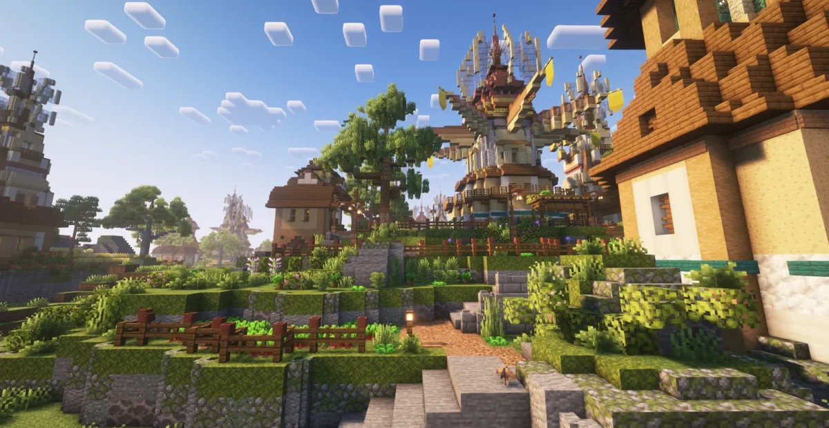 Chemin bordé de jardins menant aux tours et bâtiments d’une base d’équipe dans Minecraft