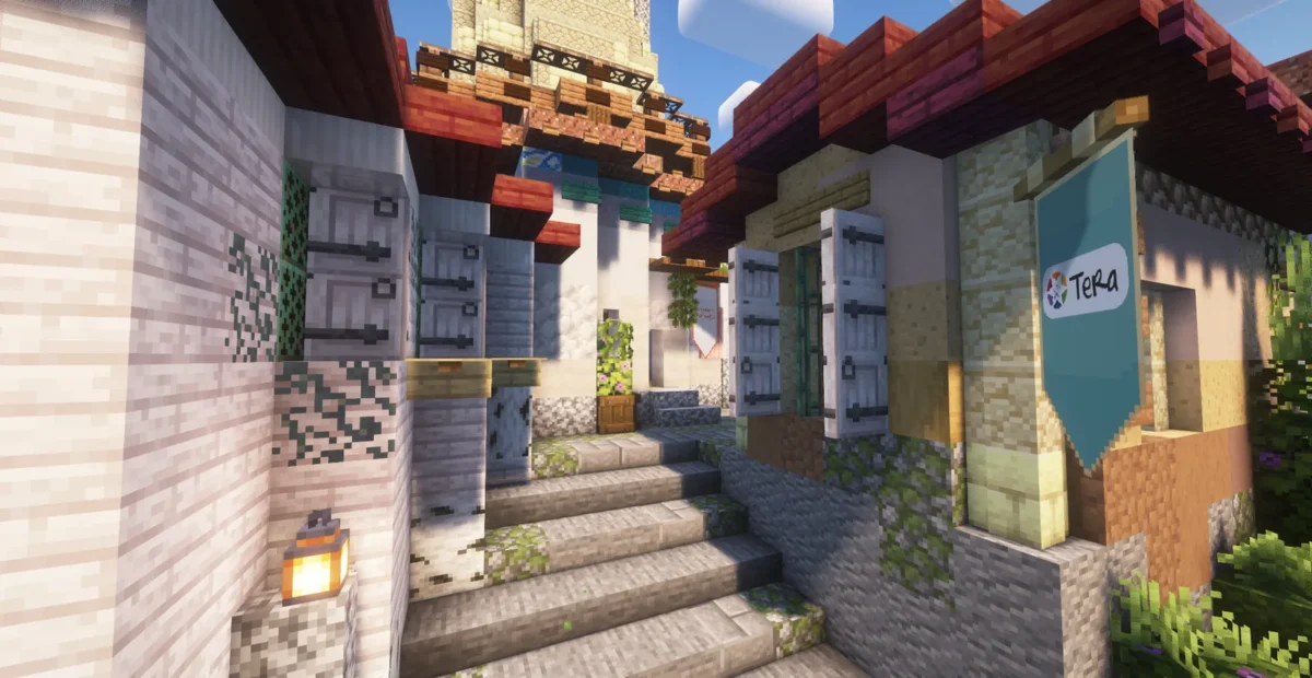 Façade du bâtiment TERA avec une bannière bleue, un escalier et des lanternes dans Minecraft