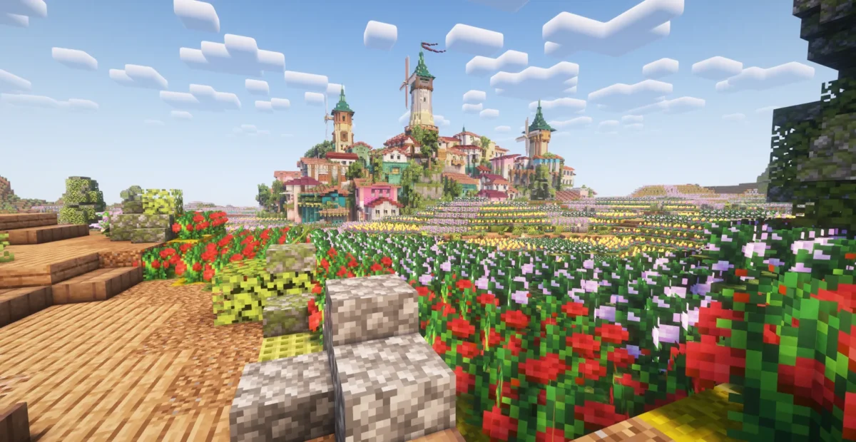 Vue de la cité principale de Minecraft avec ses tours colorées et ses grands jardins fleuris