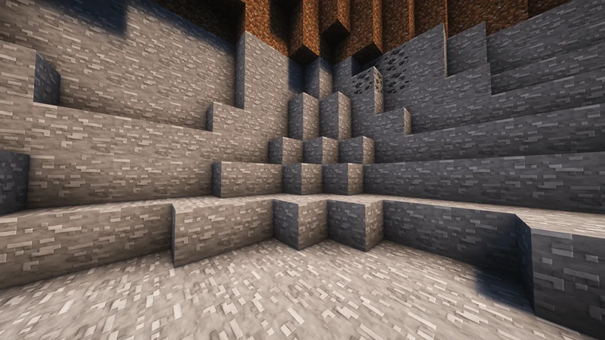 Cavité rocheuse Minecraft illustrant les variations de surface du pack Clayful sur de grandes parois grises