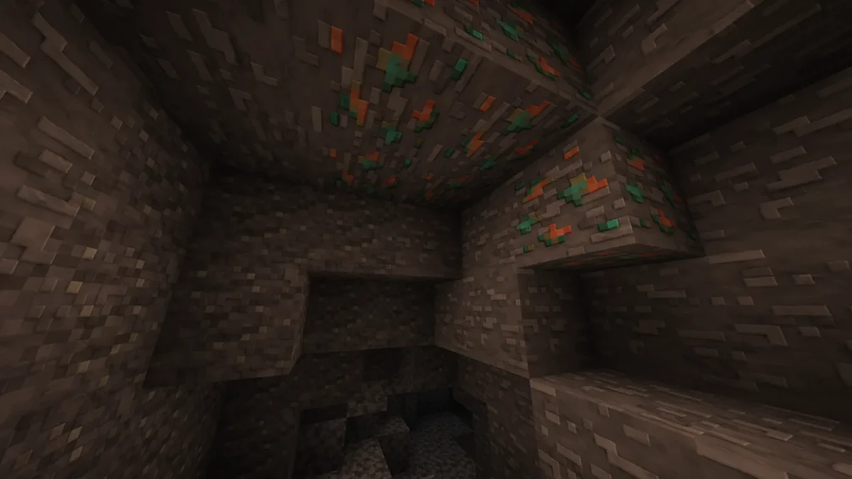 Minerai de cuivre visible dans une paroi de grotte Minecraft avec les textures sculptées du pack Clayful