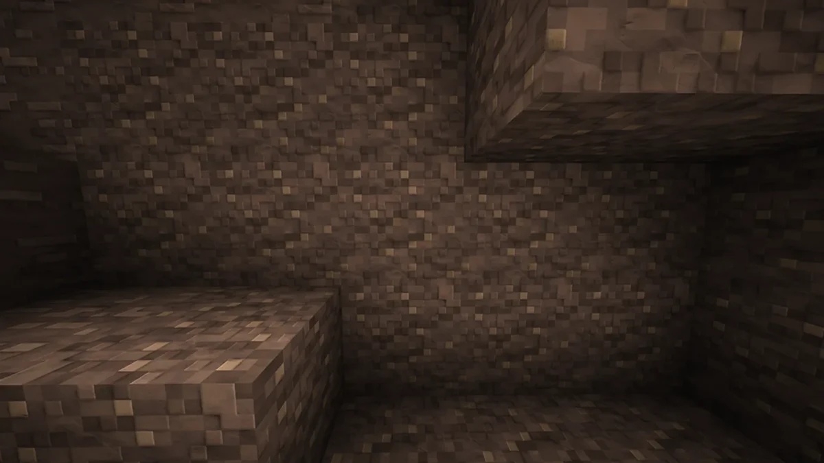 Parois rocheuses d’une grotte Minecraft présentant les textures grises modelées du pack Clayful en haute résolution