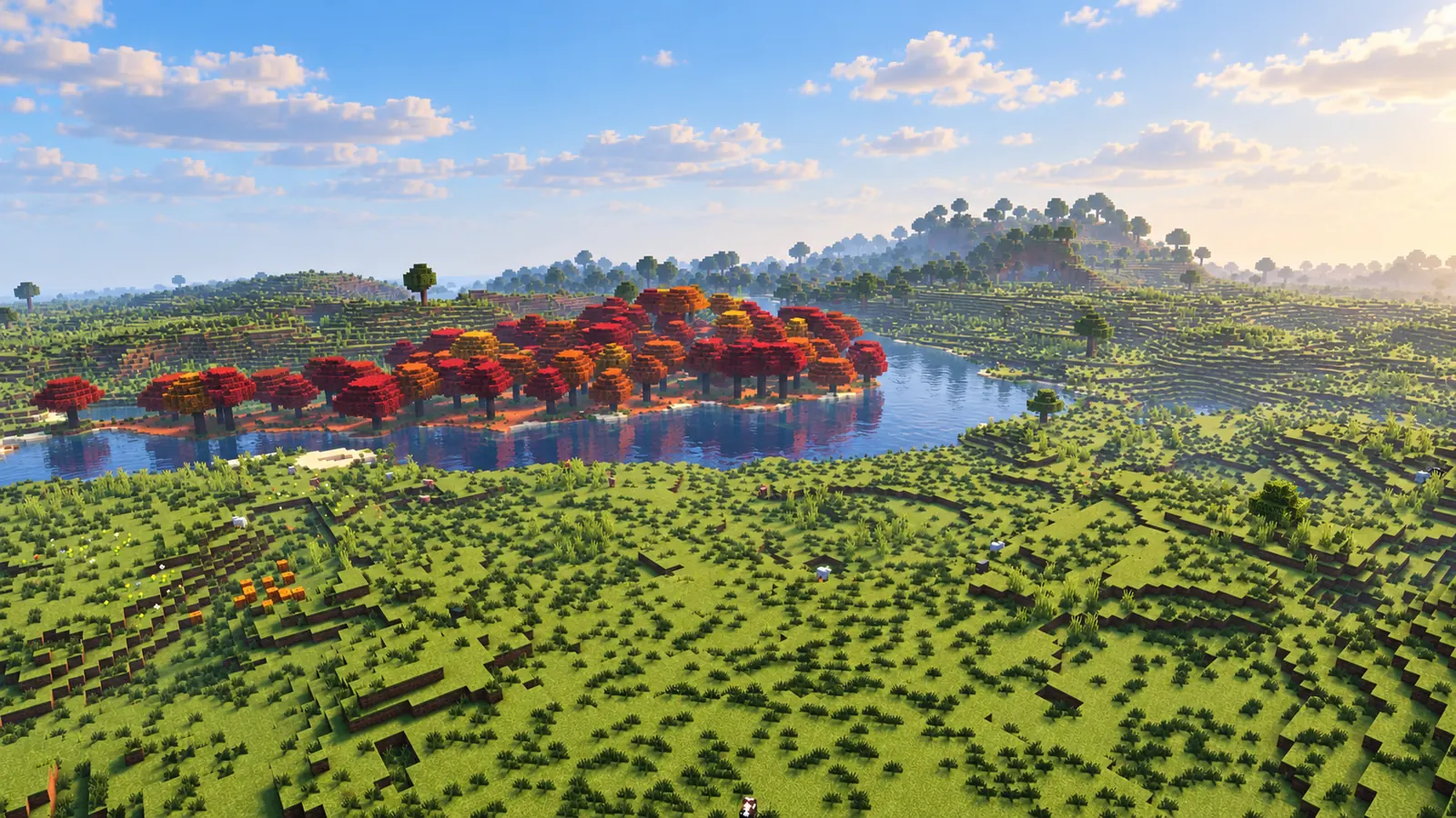 Petite île portant des arbres rouges et orange dans une rivière bordée de plaines verdoyantes dans Minecraft